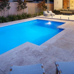 "Imperial" medium inground fibreglass swimming pool design, pictured in backyard