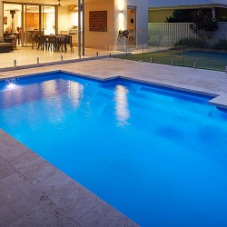 "Imperial" medium inground fibreglass swimming pool design, pictured in backyard