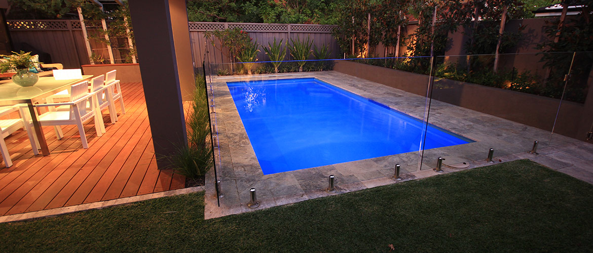 "Provincial" medium inground fibreglass swimming pool design, pictured in backyard