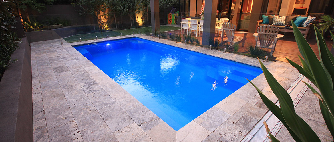"Provincial" medium inground fibreglass swimming pool design, pictured in backyard