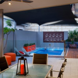 Stunning backyard setting with courtyard and swimming pool