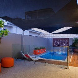 Stunning backyard setting with courtyard and swimming pool